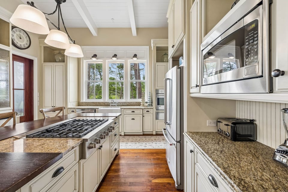 Step into your fully equipped vacation kitchen, where modern appliances meet classic elegance. Granite counters, a gas range, and everything you need await your culinary adventures.