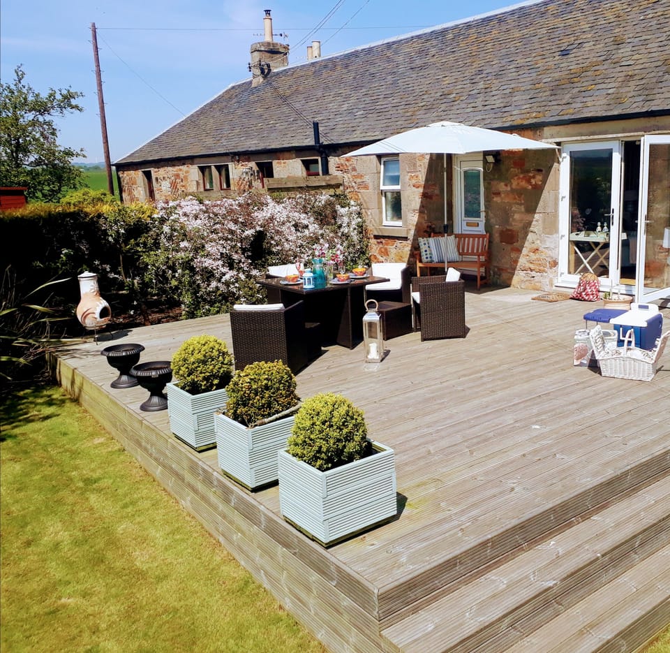 the South facing garden is completely private and enclosed