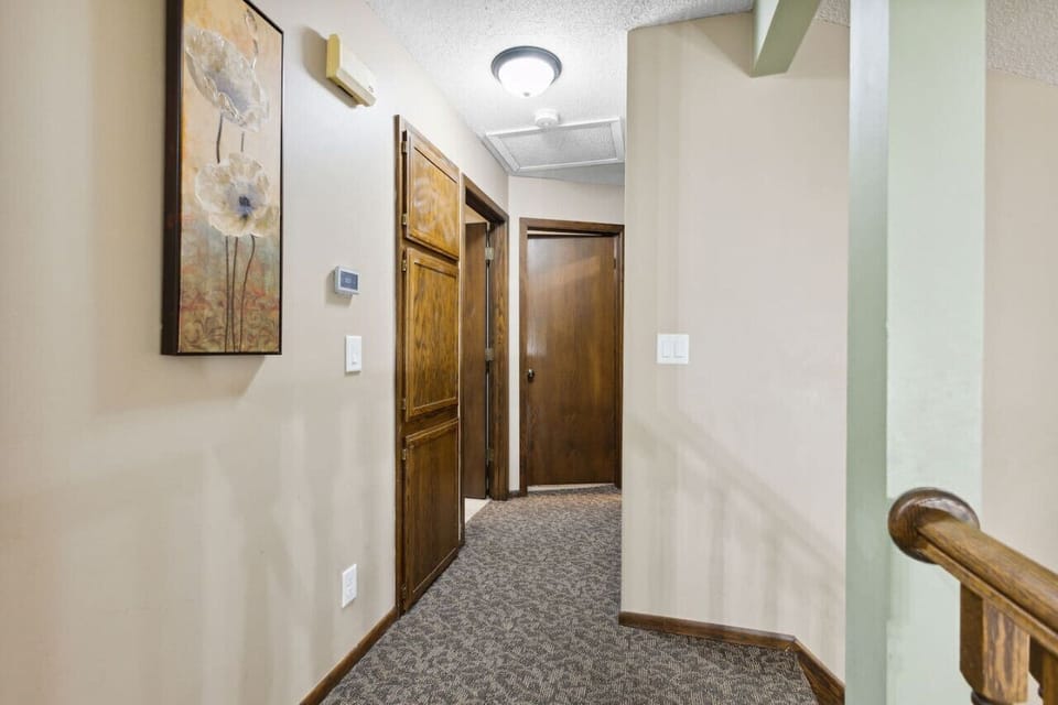 Upper hallway to 2 bedrooms and full bath