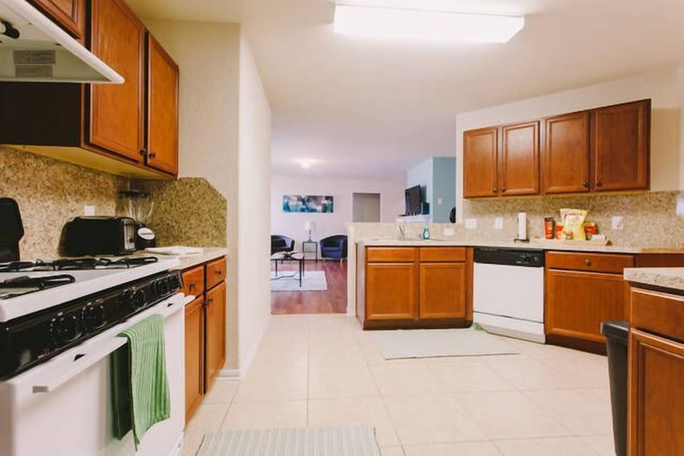 spacious kitchen with lots cabinets, grantie