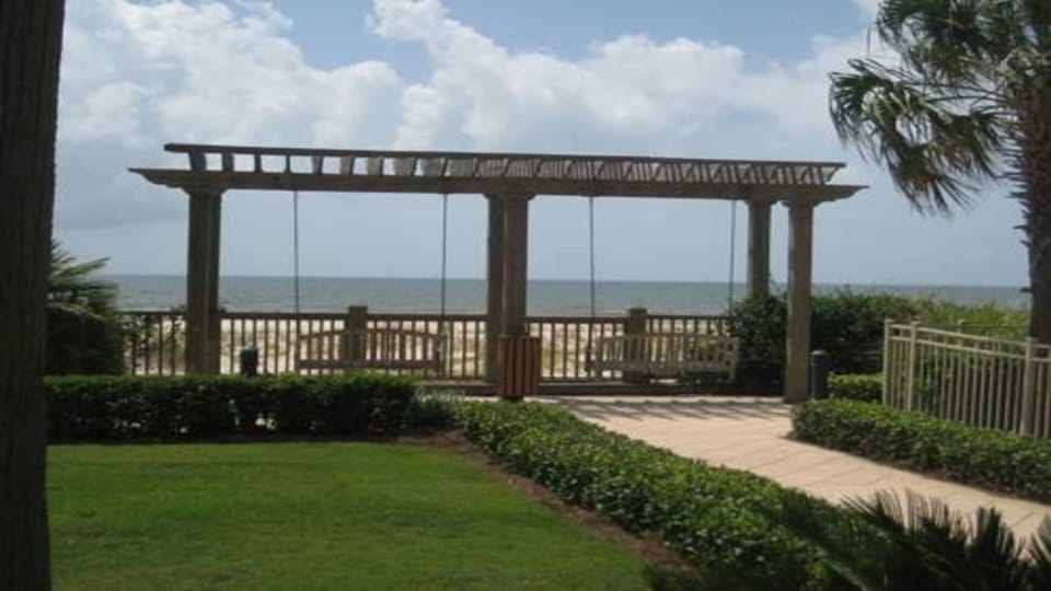 Sidewalks with swings to enjoy the seeing the beach.