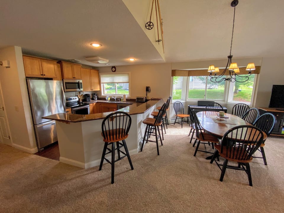 Kitchen is fully stocked for all your cooking needs and includes breakfast bar that seats 4 and a dining table that seats 6
