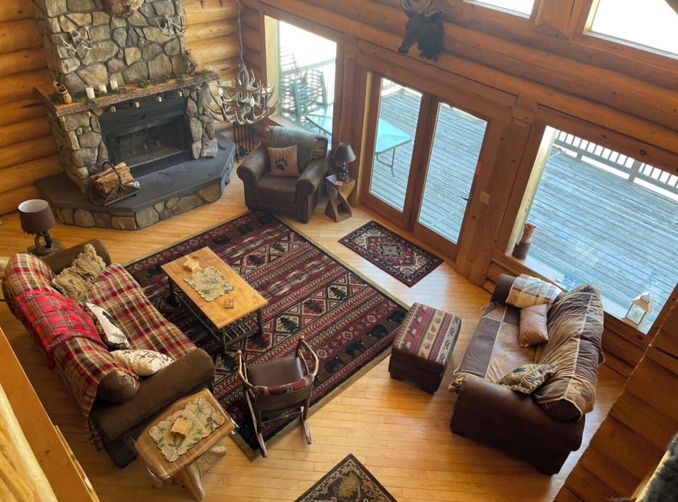 Wood burning fireplace in 30ft Cathedral Great Room . 
