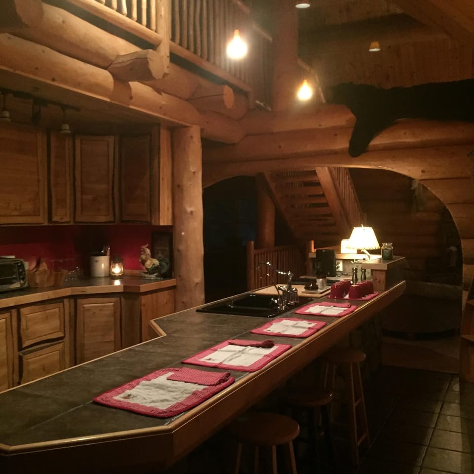 Kitchen with 18’ island Perfect for gathering and meal prep Weber grill . 