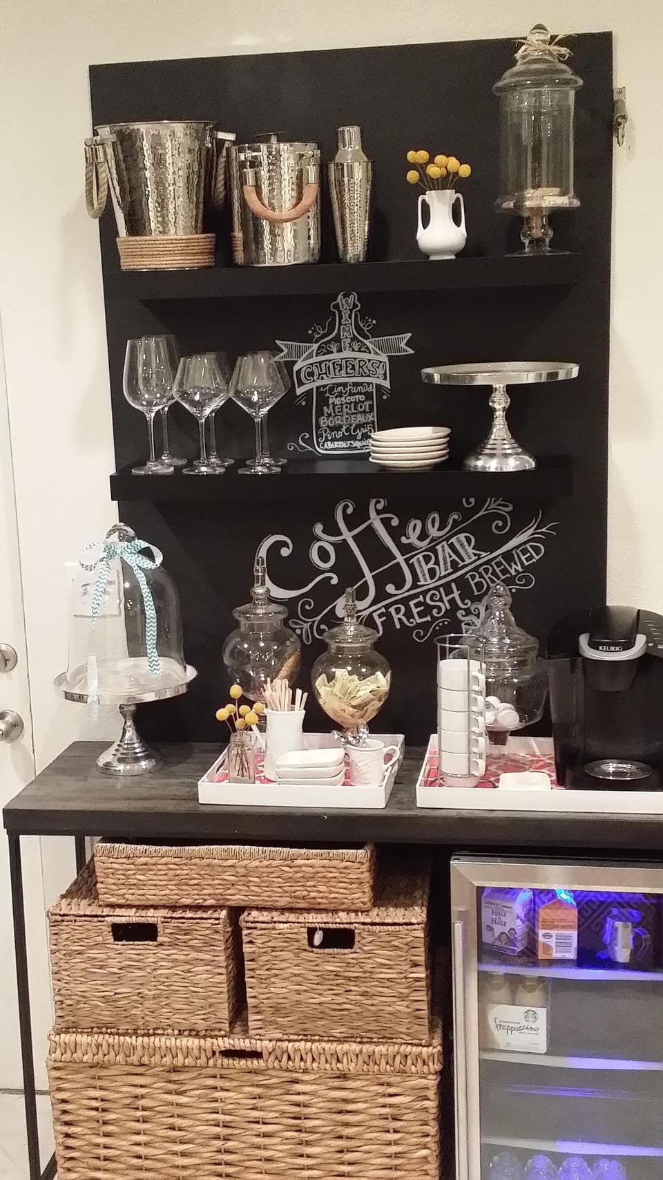 Beverage Center has a refrigerator, Keurig and Riedel Wine Glasses