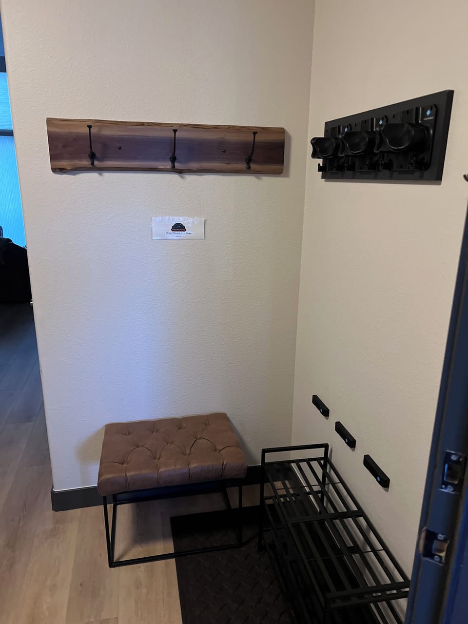 Added a ski/snowboard rack. Hang equipment from the bottom up through grabbers