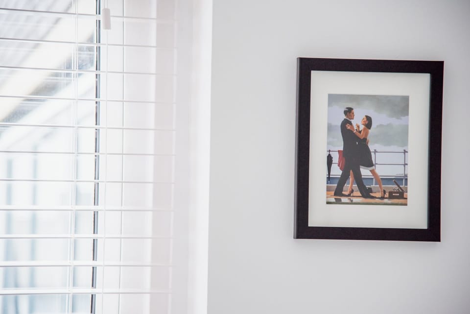 Bedroom 2: double at rear of building with fitted wardrobes, bedside tables, fan