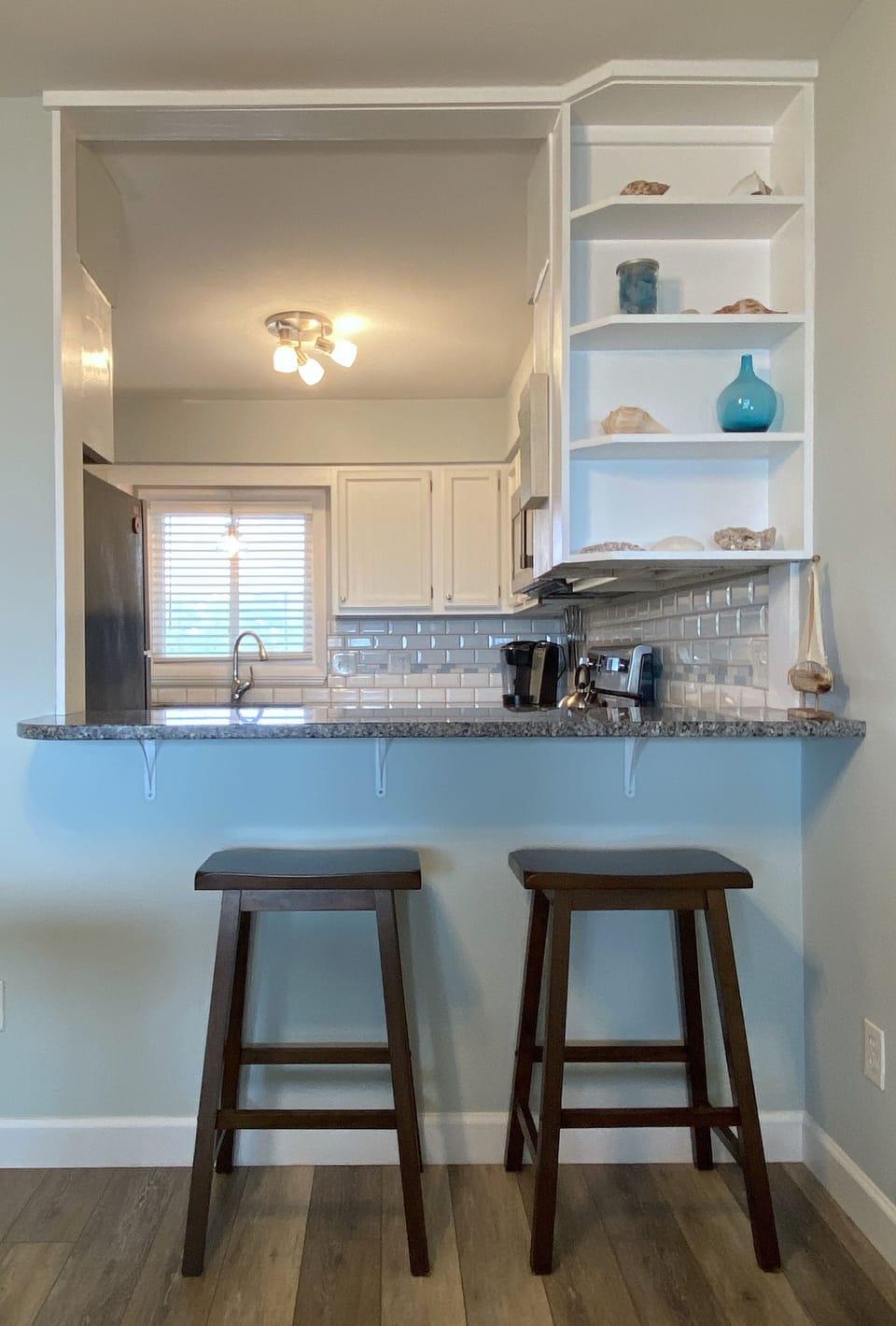 View of breakfast bar and kitchen from living room.