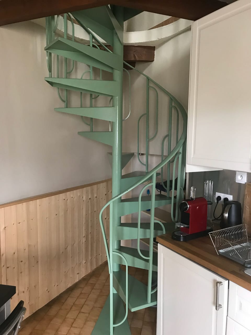 Spiral staircase takes you up to the bedroom.