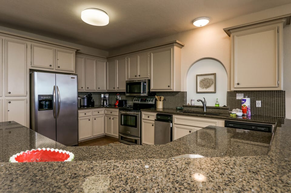 Kitchen equipped with Keurig, toaster, blender, microwave