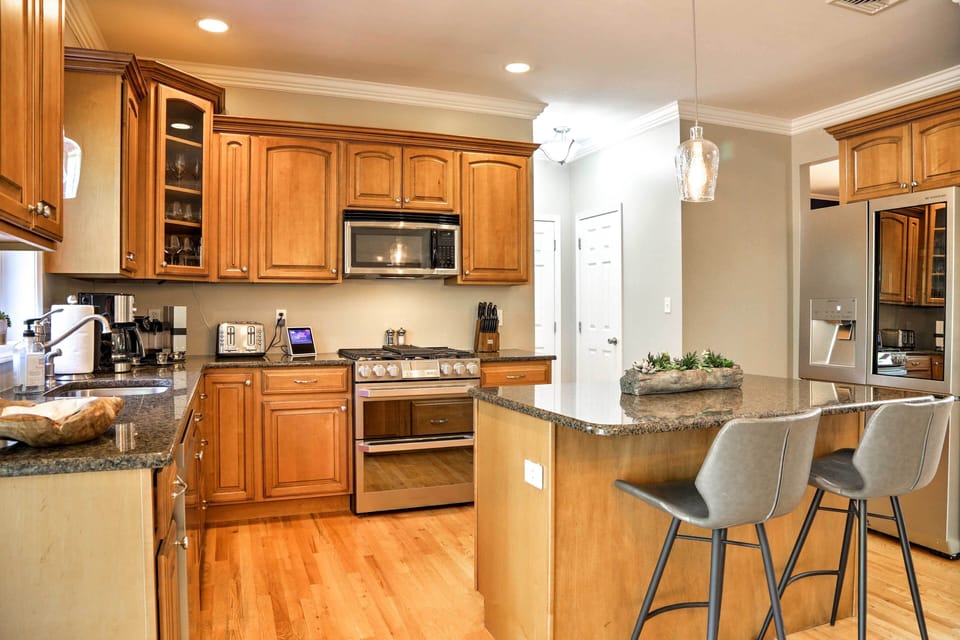 Stainless steel appliances highlight the fully equipped kitchen.