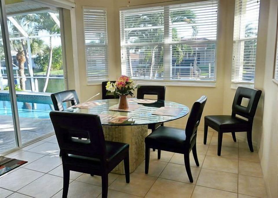 Dinning area with water view and sliding door access to lanai.