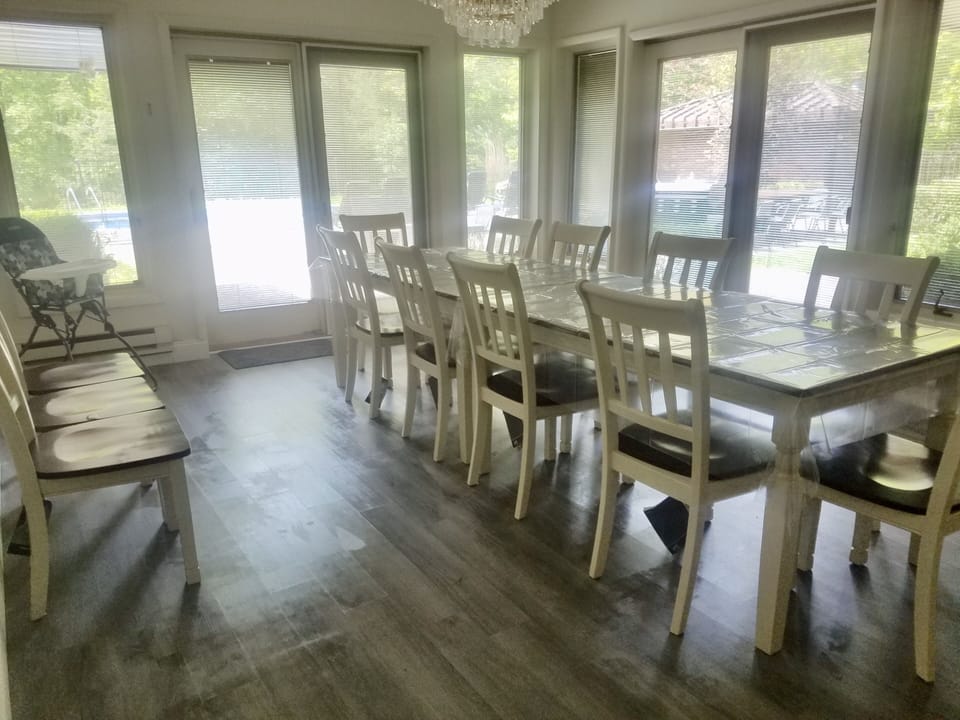 Formal dining seats 12; plus high chair. Sliders to pool patio and grill.