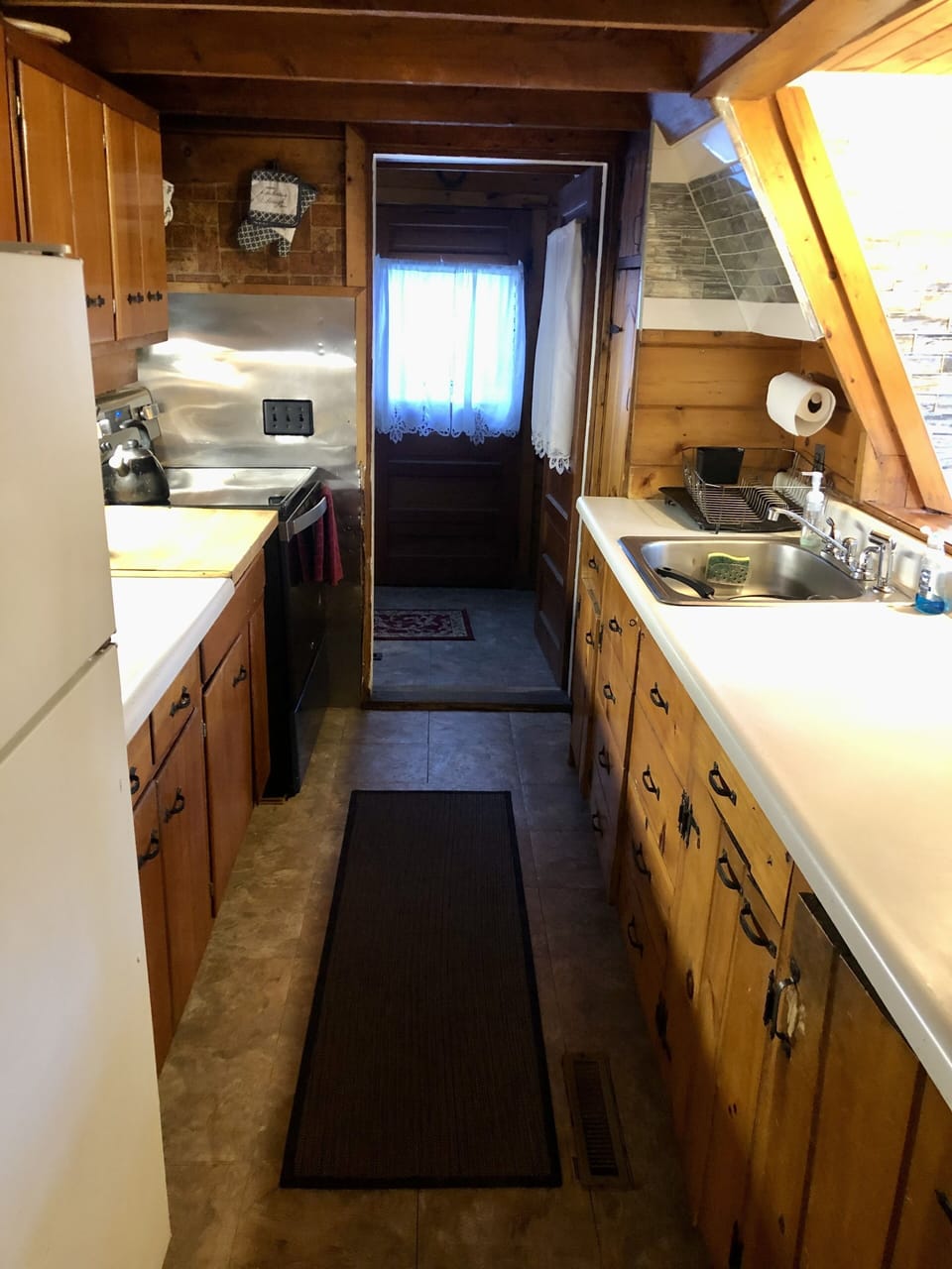 Fully stocked kitchen; stove, oven, sink, pots & pans, utensils 