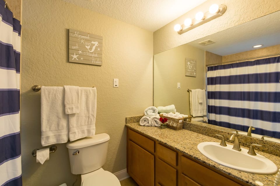 Master bath has combo shower and deep jacuzzi tub
