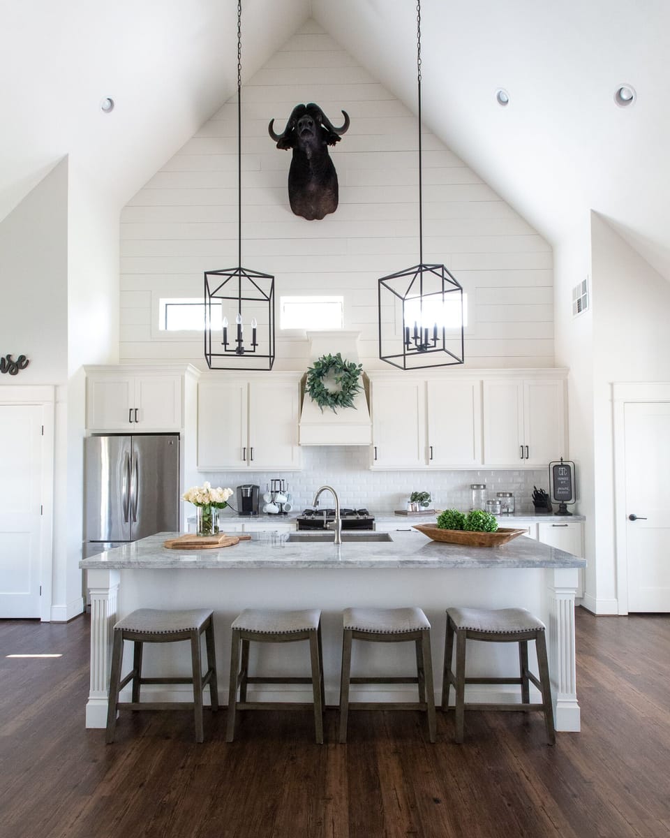 Kitchen with eat-in island.  A dining room that seats 8 people is to the right.
