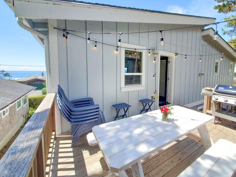 Back deck with ocean view, picnic table and propane grill