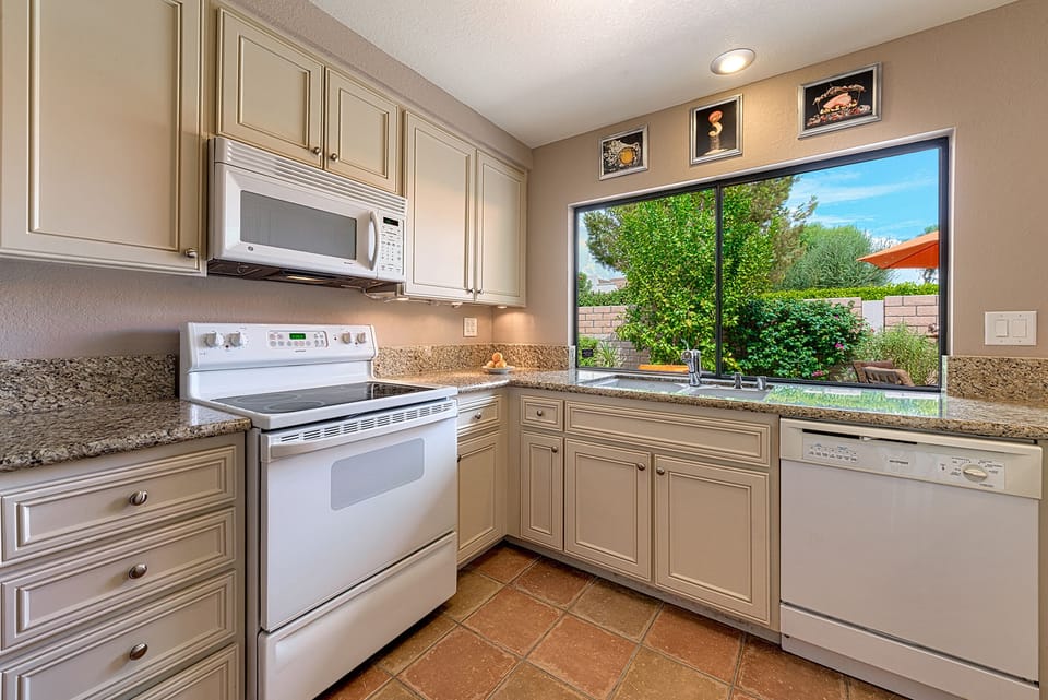 Kitchen is fully stocked with coffee maker, toaster, blender and more