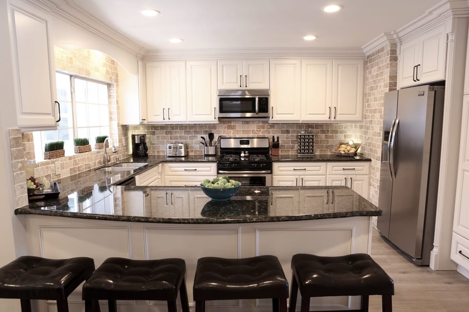 Custom Kitchen with Granite Countertops and Stainless Steel Appliances