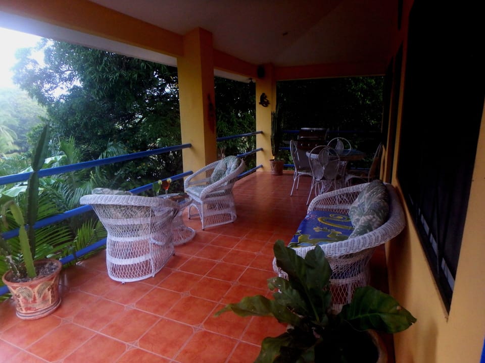 Balcony with gas BBQ and comfy chairs