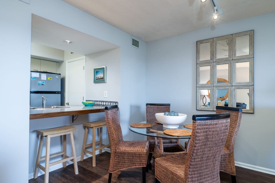 Share meals around the table for four. The open space allows all to be involved in the activities.