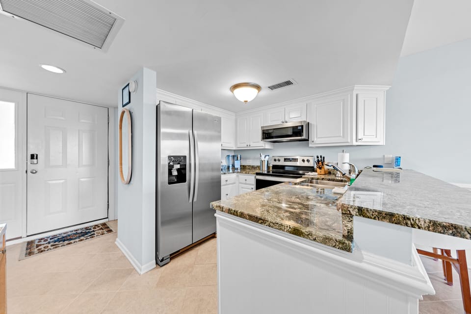 The kitchen is fully stocked and has stainless steel appliances!