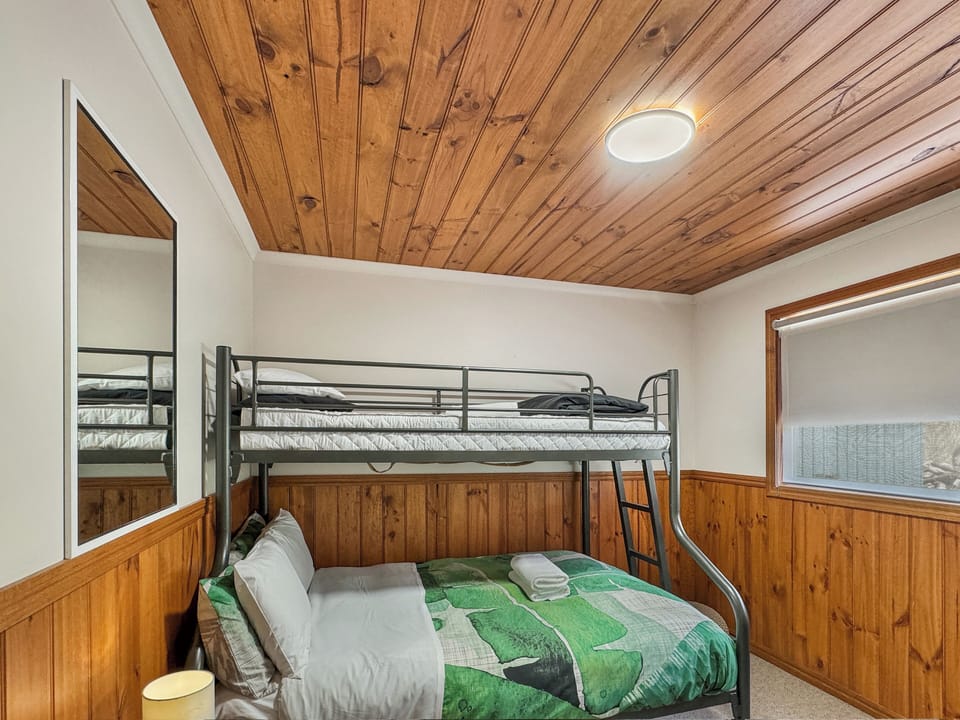 Cozy versatility: Third bedroom with a double bed and single bunk. Comfortable sleep awaits.