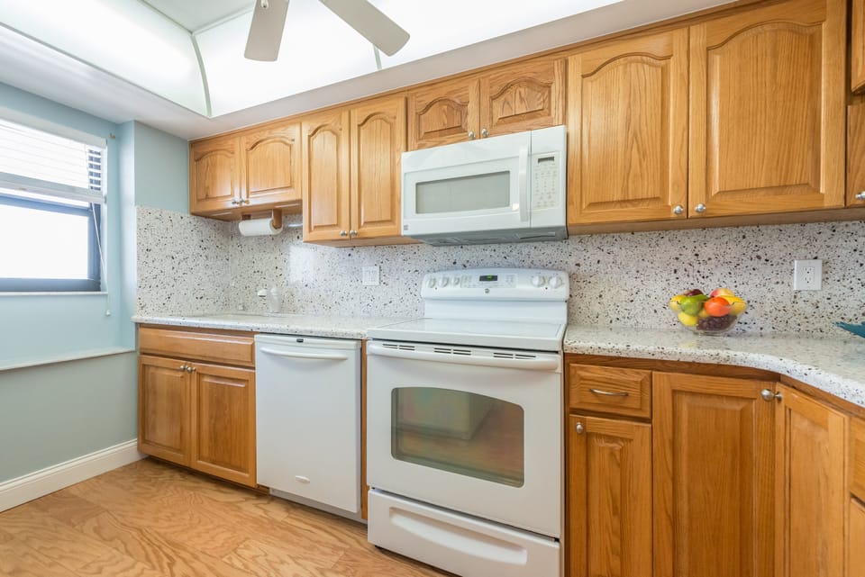 Classic wooden kitchen with ample space for cooking and gathering.