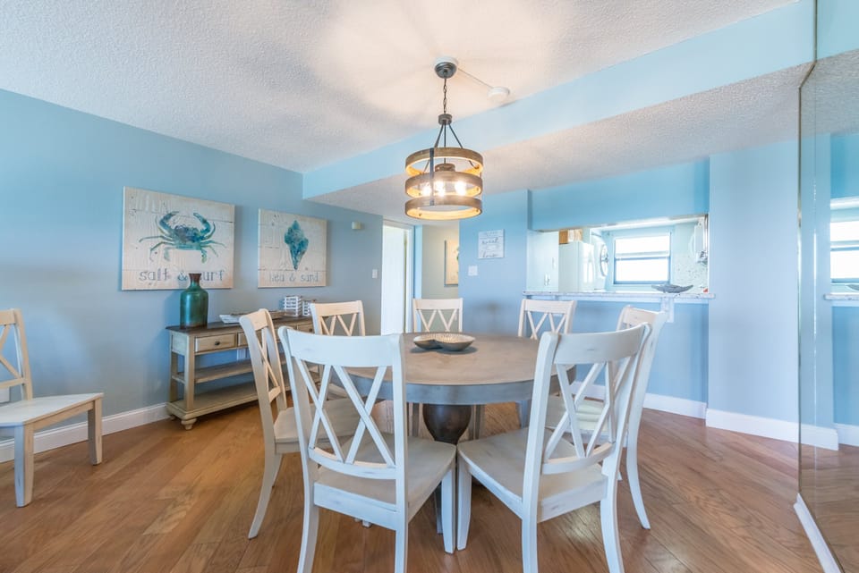 Dining area with a beautiful ocean view, perfect for meals together.