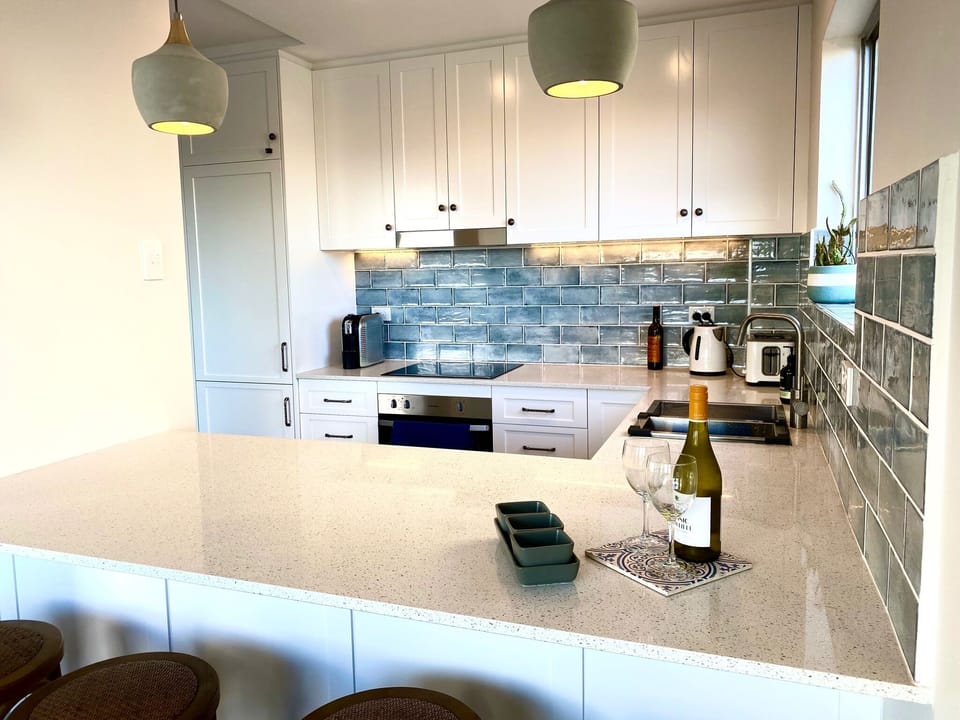 Show off your culinary skills using the stone benchtops and quality appliances