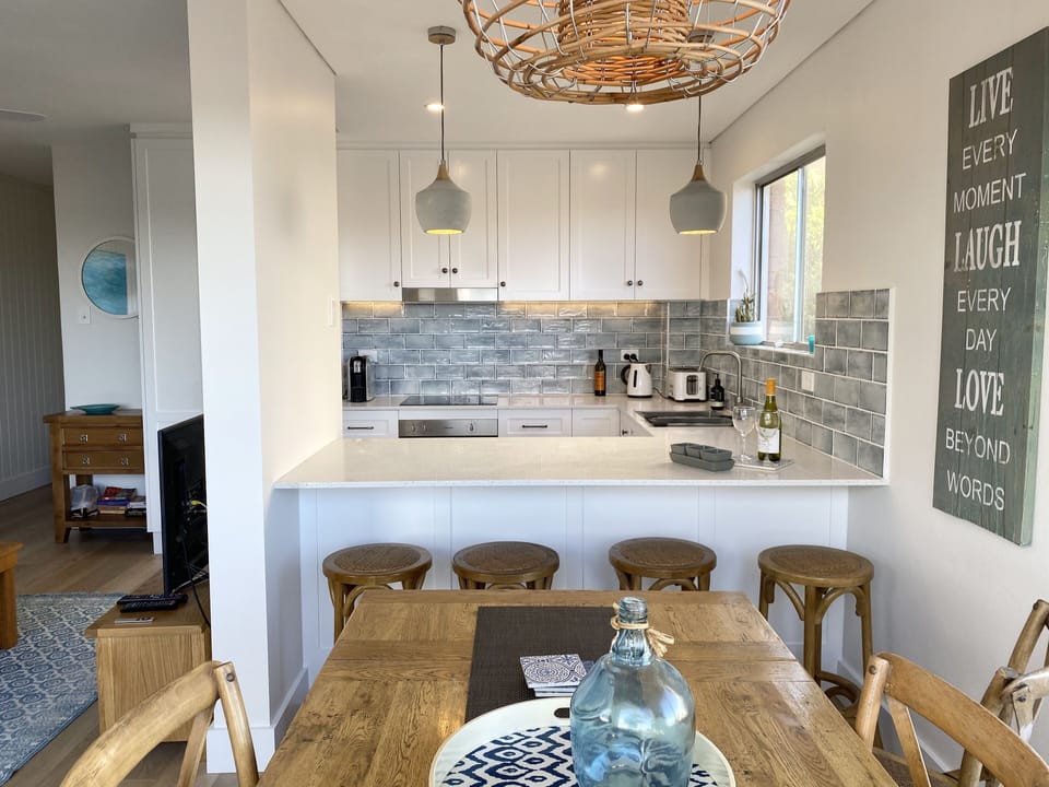 Looking from the dining room to the kitchen