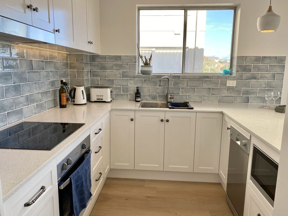 New kitchen with quality s/s appliances and all cooking essentials and utensils