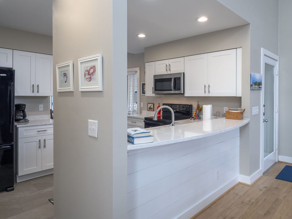 The beautiful kitchen opens into the dining room.