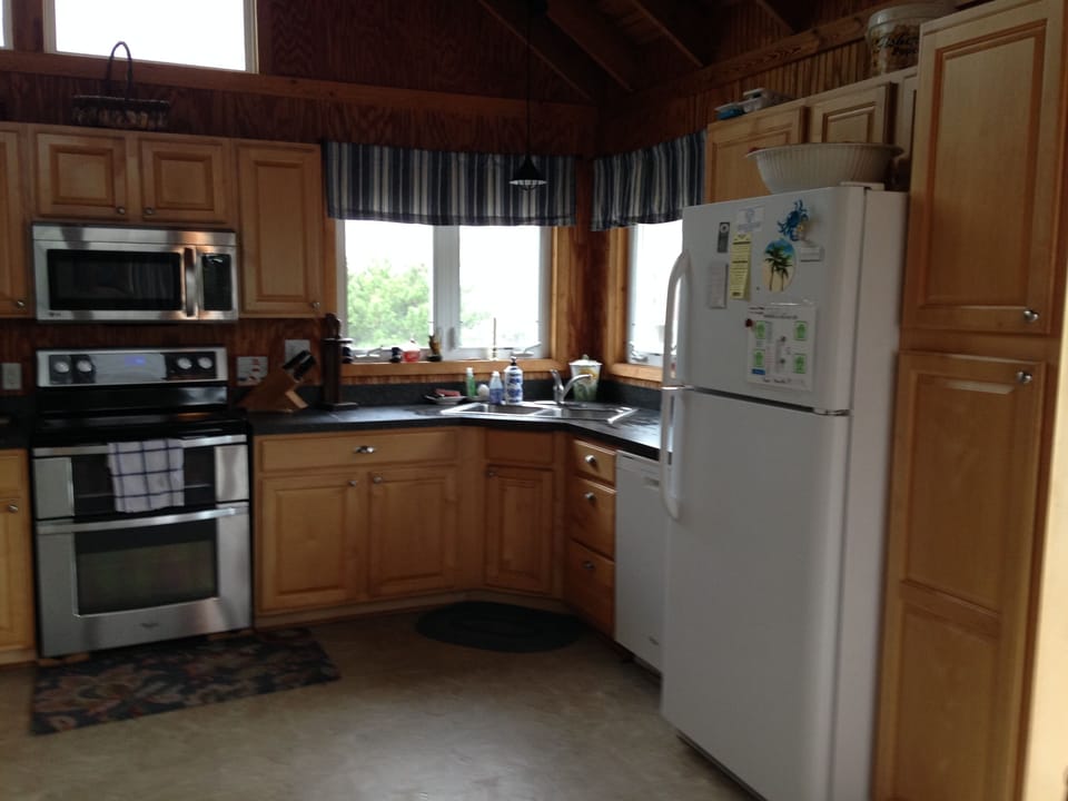 New stove and oven, kitchen window looks bayside