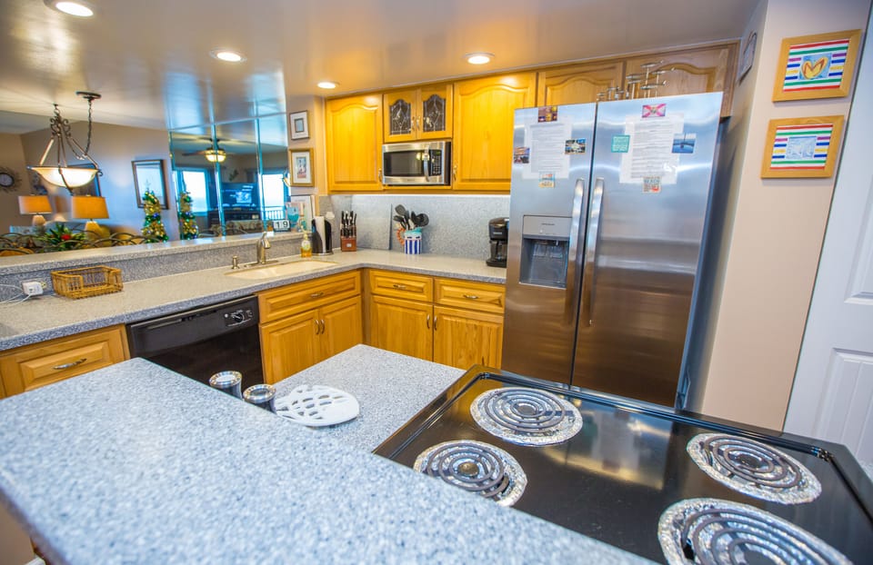 Spacious kitchen right in the middle of the condo so view of ocean and icw.
