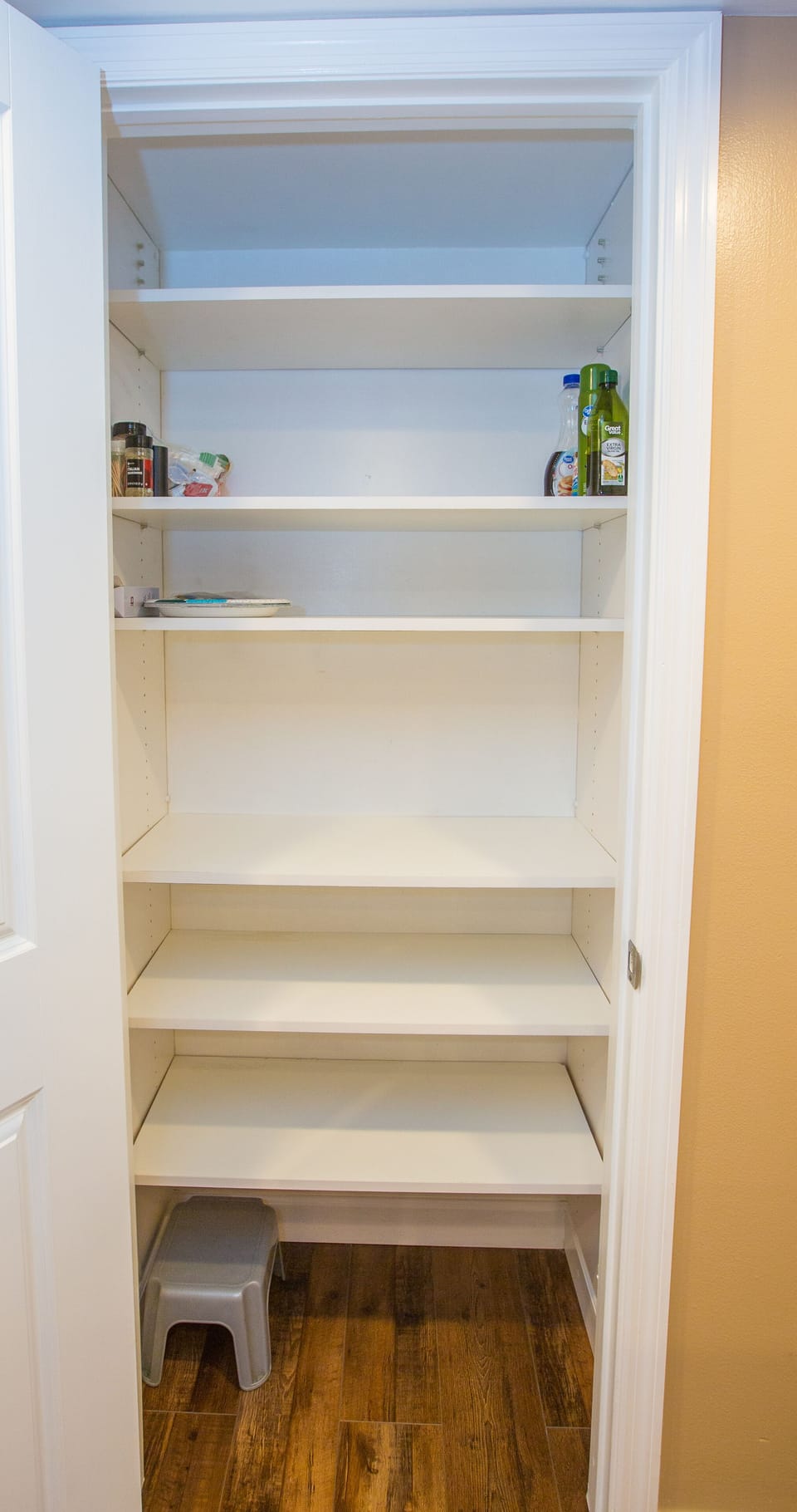 Kitchen pantry with lots of shelves for ample grocery storage.