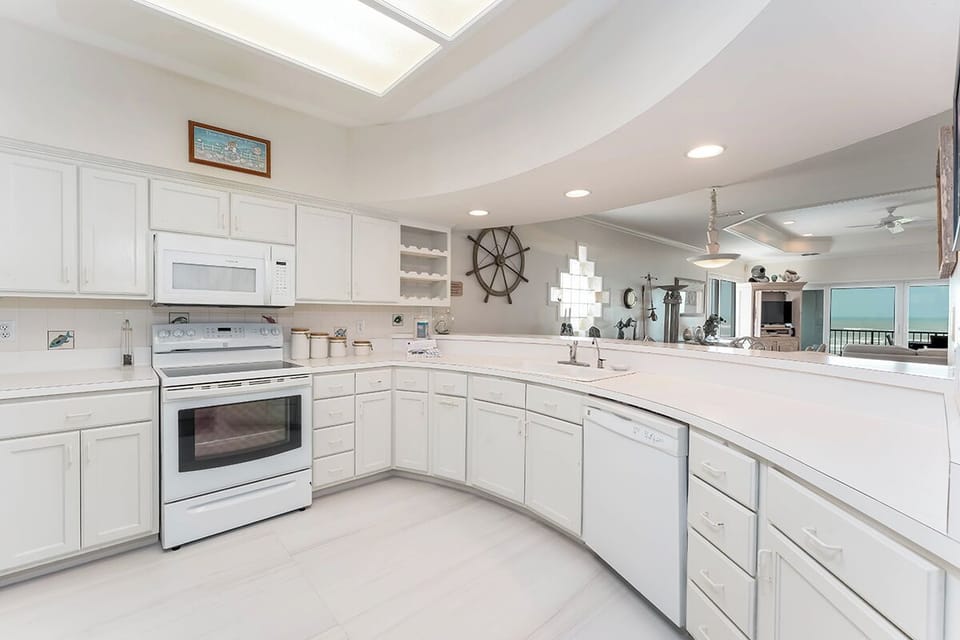 Stainless sink and thoughtful layout make this kitchen a breeze to prep meals using fresh local seafood or your favorite recipes.