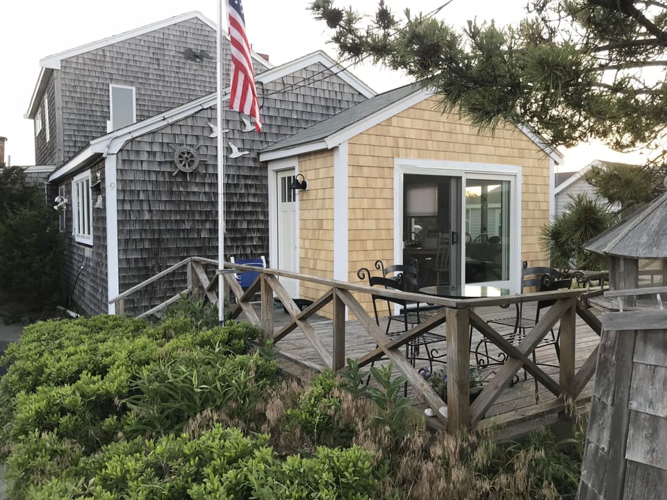 Oversized patio slider leads to large front deck.