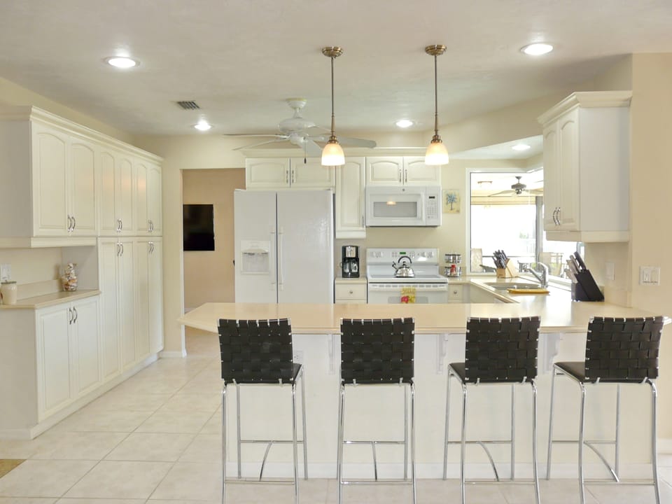 Fully equipped kitchen with beautiful water view of the canal.