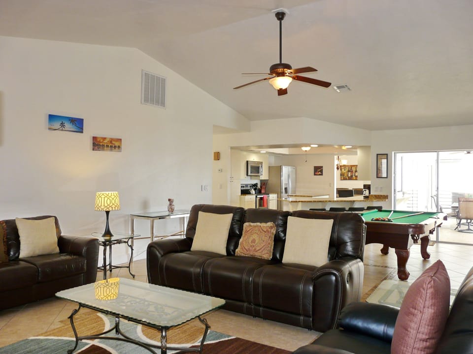 Family room with queen sofa bed, 50' TV & game set, sofa recliners.