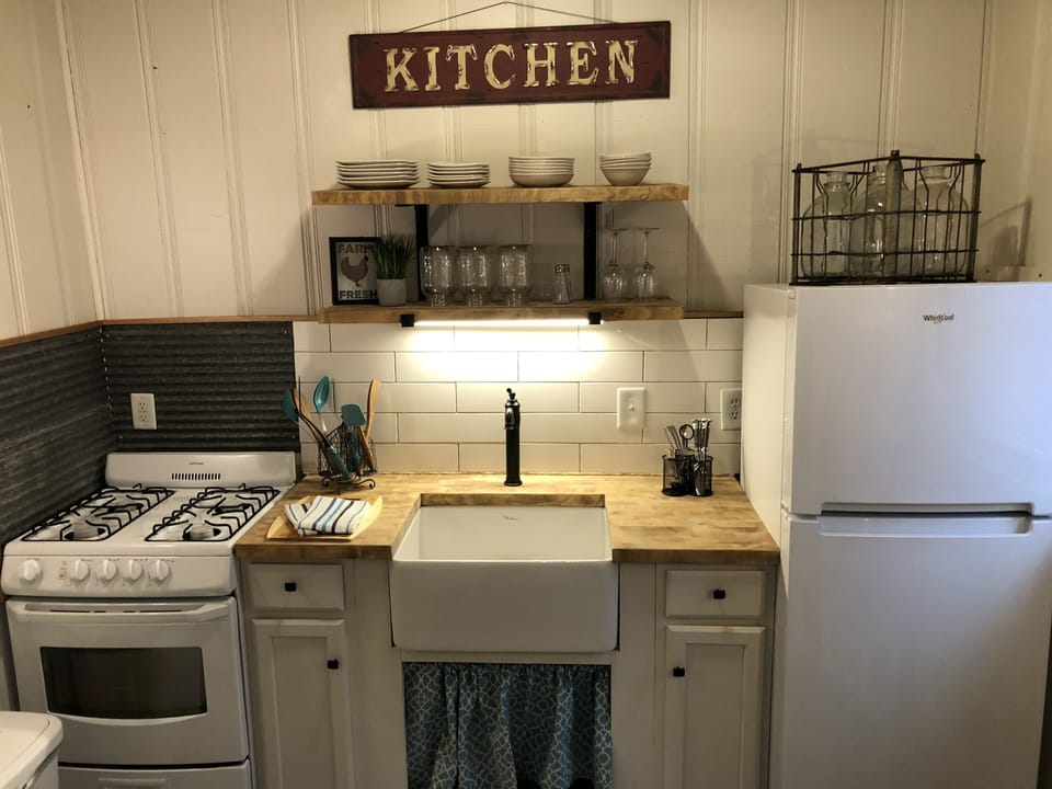 Kitchen equipped with Fridge, Stove and Microwave