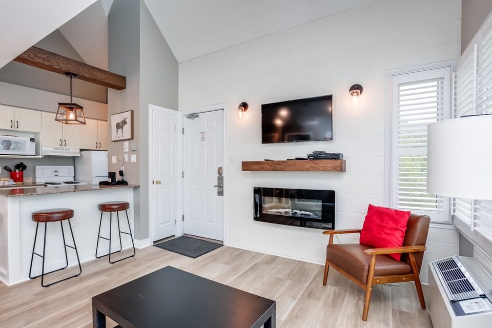 Kitchen island is beside the living room. 