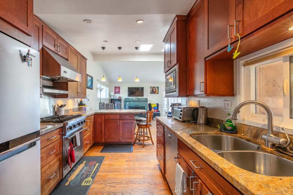Fully equipped kitchen with Viking stove, new fridge, and everything you need