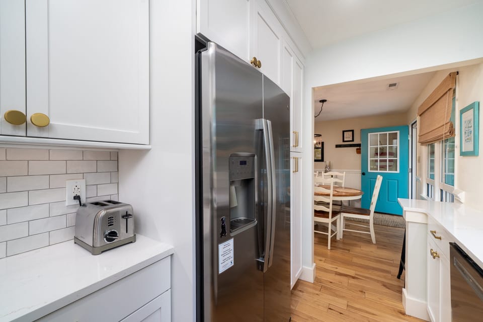 The galley kitchen sits next to the dining area.