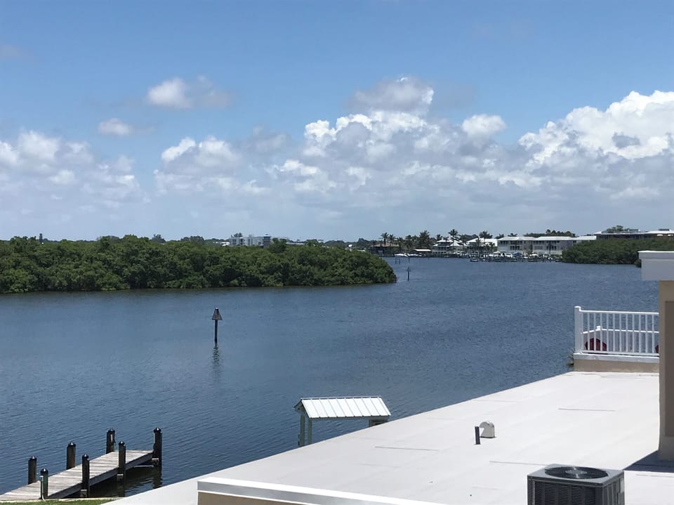 Private balcony just outside  the bedroom.Watch the dolphin and manatee play!