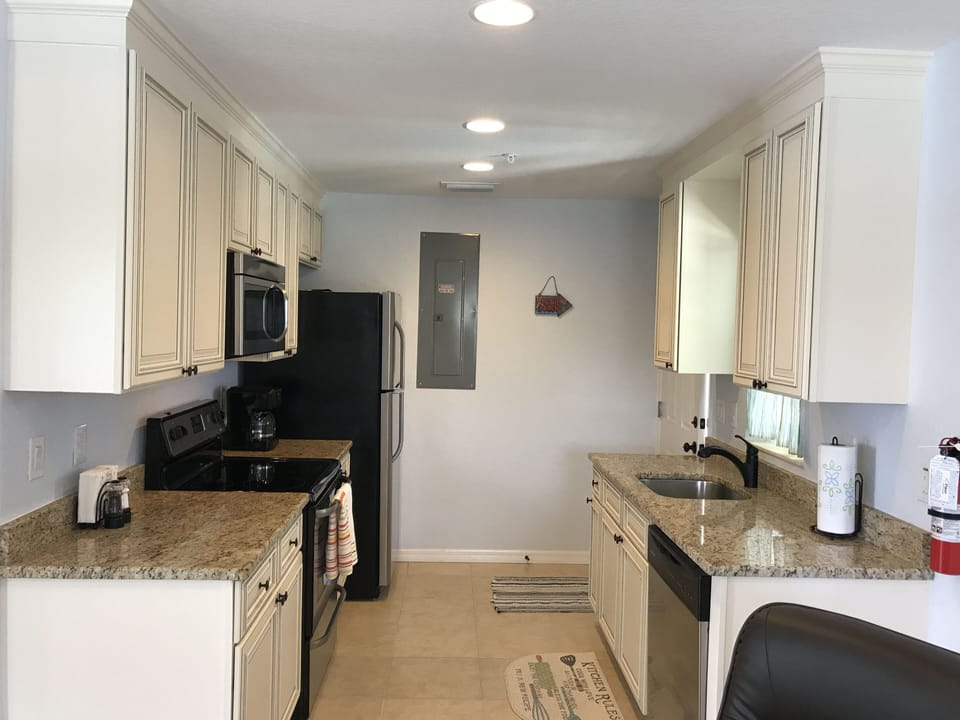 fully stocked kitchen.custom cabinets, granite countertops ,stainless appliances