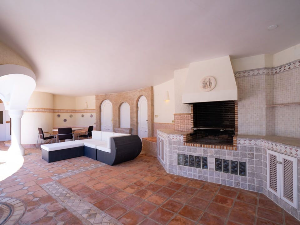 Wood, Interior Design, Flooring, Living Room, Floor, Hall, Hearth, Building, Hardwood, House