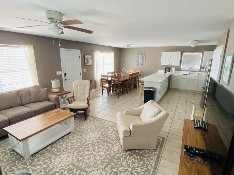 open concept living room, kitchen and eating areas