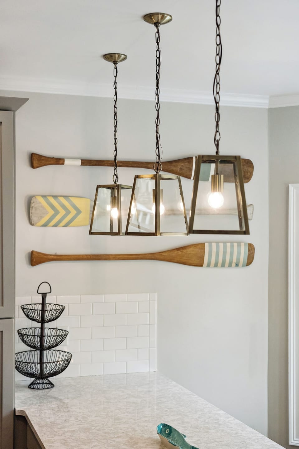 Step into your stylish kitchen where warm pendant lights illuminate the island, perfect for morning coffee or evening meal prep.