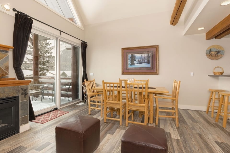 Dining area open to living room, kitchen, with seating for 6 & +4 at counter.